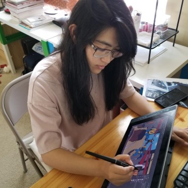 Jing Working on the first page of "Shi's Journey..."